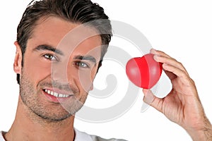 Portrait of a man holding a heart