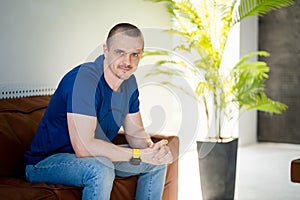 Portrait of a man at home. Attractive male