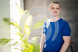 Portrait of a man at home. Attractive male