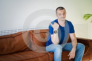 Portrait of a man at home. Attractive male