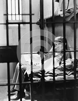 Portrait of man in jail photo