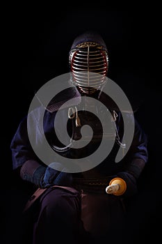 Portrait of man kendo fighter with bokuto