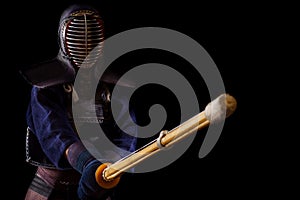 Portrait of man kendo fighter with bokuto