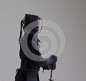 Portrait of man kendo fighter with shinai . Shot in studio