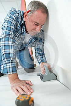 portrait man and laminated floor installer