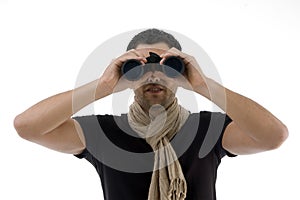 Portrait of man looking into binocular