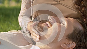 Portrait of a man lying on a female knees