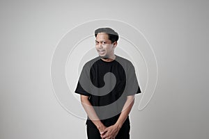 Portrait of a man making a silly funny face, showing a funny brainless silly facial expression photo