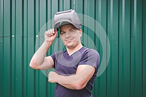 Portrait of a man with a mask of a welder