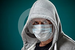 A portrait of man with medical face mask. People, medicine, healthcare concept. Coronavirus protection