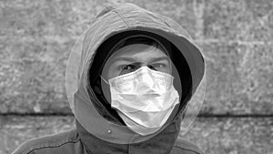 portrait man in a medical mask monochrome
