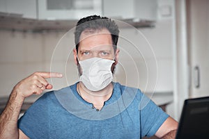 Portrait of a man in a medical mask, personal protective equipment against viruses and diseases