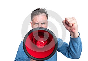 Portrait of a man with a megaphone and raised hand with a fist in protest gesture, isolated on white background. Front view.