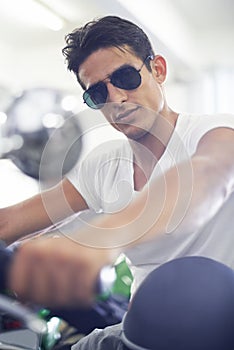 Portrait, man and motorcycle with sunglasses, cool and travel with training, riding and journey. Face, person and biker