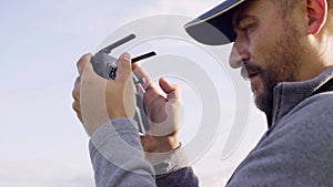 Portrait of a man operating a drone quadrocopter