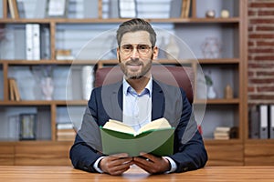 Portrait of a man, a pastor of a church, a religious community of various denominations, giving his sermon online