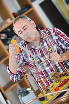 Portrait man pipe cutting