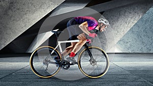 Portrait of man, professional cyclist training, riding on professional sport bike around city
