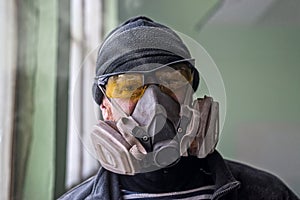Portrait of a man in a respirator, free space photo