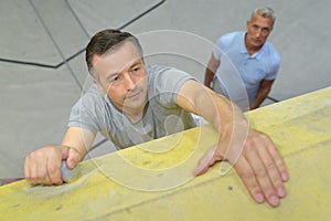 portrait man rock climbing