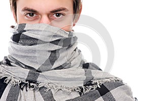 Portrait of a man with scarf covering face