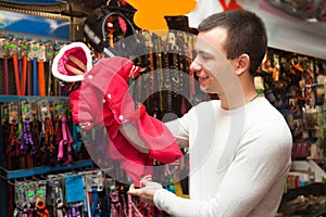 Portrait of man selecting collars