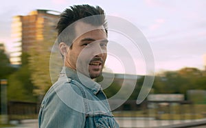 Portrait of a man while spinning on blurred background