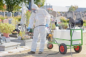 portrait man spraying chemical weedkiller
