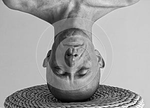 Portrait of a man standing on his head