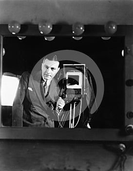 Portrait of a man standing with a large format camera