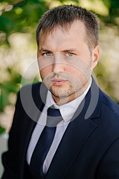 portrait of man in suit and tie outdoors. clothes for business or celebration.