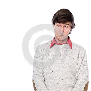Portrait of a man in a sweater with a stupid look on his face