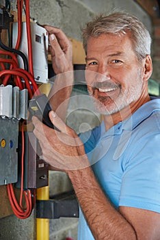 Portrait Of Man Taking Electricity Meter Reading