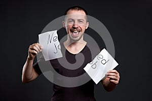 Portrait of a man tearing up an inscription on paper need a job