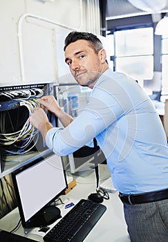 Portrait, man or technician with office cables for cyber security glitch or hardware cords. Engineering, programmer or