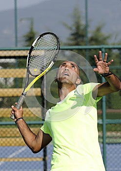 Portrait of a man with tennis racket