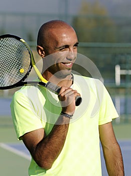 Portrait of a man with tennis racket