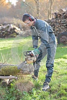 portrait man using chainsaw