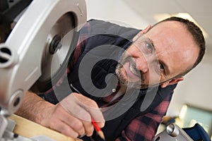 portrait man using circular saw