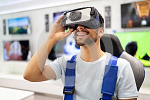 Portrait of man using virtual reality headset at exhibition show. VR technology simulation concept