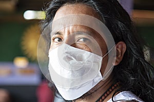 Portrait of man wearing face mask to protect from coronavirus