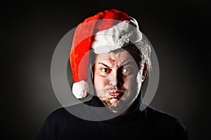 Portrait of man wearing Santa hat