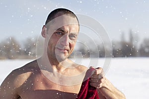 Portrait of a man in winter after swimming