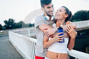 Portrait of man and woman during break of jogging