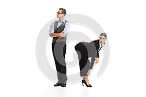 Portrait of man and woman, employees cooperating with each other isolated on white background. Office romance