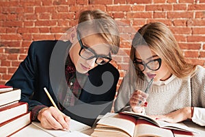 Portrait of man and woman studying at library