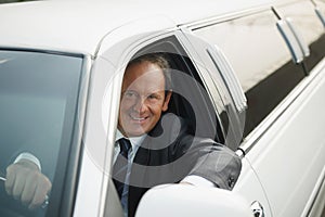 Portrait Of Man Working As Driver In White Limousine