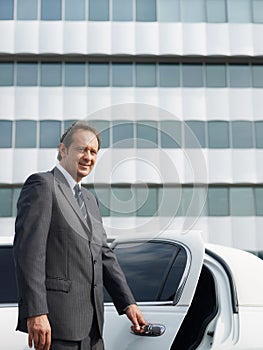 Portrait Of Man Working As Driver In White Limousine