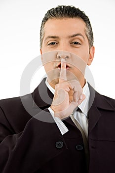 Portrait of manager instructing to be silent photo