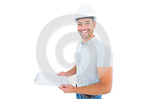 Portrait of manual worker holding clipboard